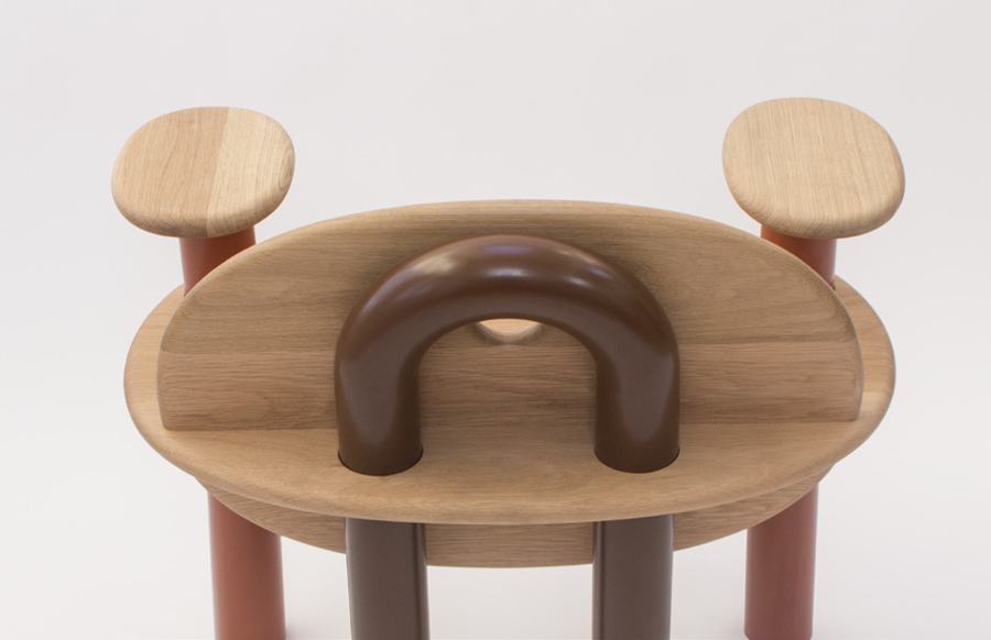 Looped leg passing through the seat, from behind