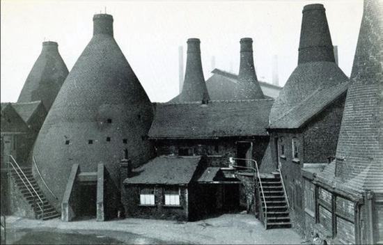 Archive photograph of bottle kilns in a pottery yard