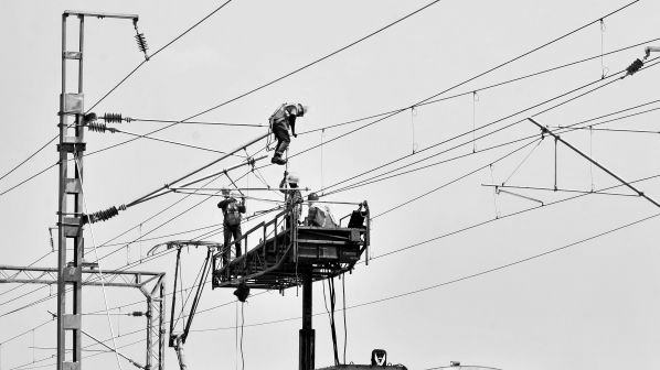 Engineers working on overhead railway lines